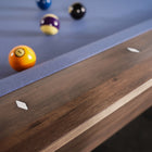 Close-up of Nixon Desyn 8' Slate Pool Table in Walnut by Nixon Billiards with dining top option.