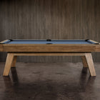 The Nixon Desyn 8' Slate Pool Table by Nixon Billiards features a walnut finish and blue felt.