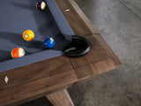 Close-up of Nixon Desyn 8' Slate Pool Table corner in walnut by Nixon Billiards, blue felt.