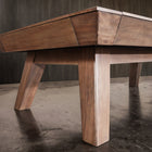 Nixon Billiards Desyn 8' Walnut Pool Table with angled legs on polished concrete floor.