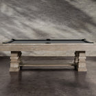 A Nixon Huck 7' Slate Pool Table in Grey White Oak rests on a concrete floor.