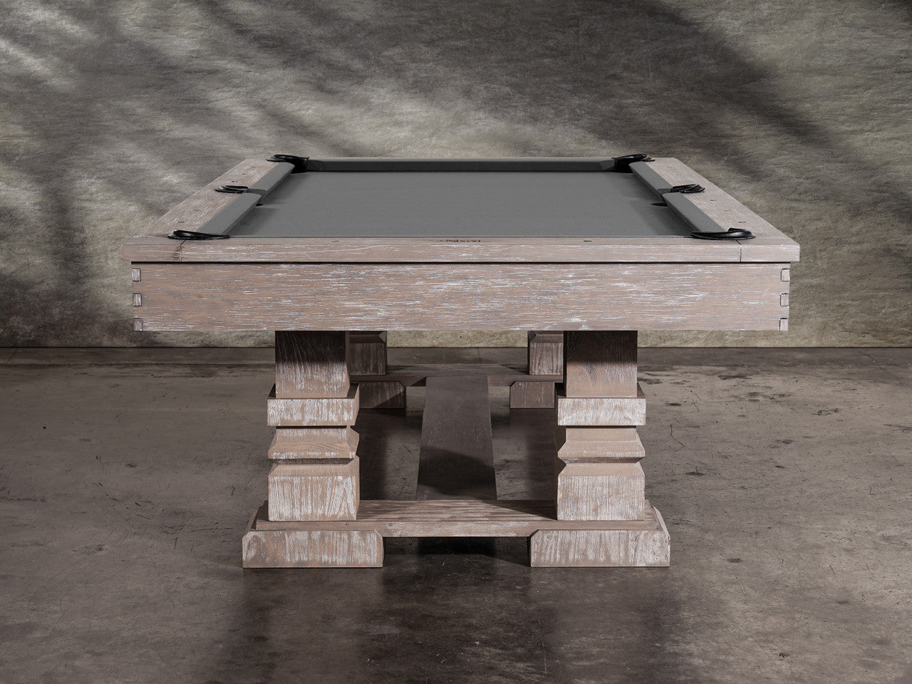 Nixon Huck 7' Slate Pool Table in Grey White Oak by Nixon Billiards, shown on concrete floor.