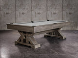 The Nixon Jasper 8' Slate Pool Table by Nixon Billiards features a weathered slate finish and dining top.
