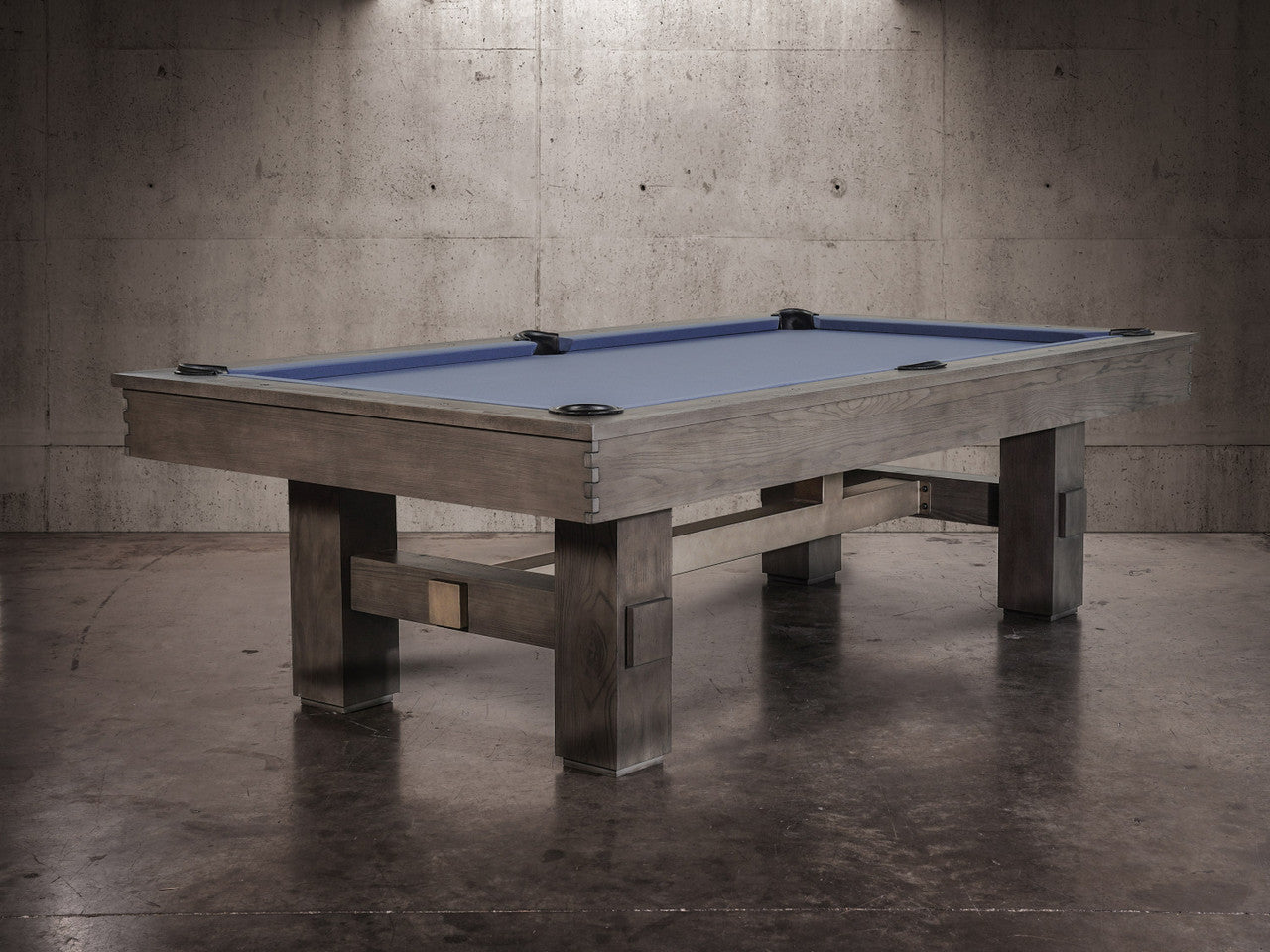 Nixon Billiards Kemp 8' Slate Pool Table in Grayson Grey with blue felt in concrete room.