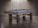 Nixon Billiards Kemp 8' Slate Pool Table in Grayson Grey with blue felt in concrete room.