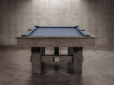 The Nixon Kemp 8' Slate Pool Table by Nixon Billiards features a Grayson Grey finish and blue felt.