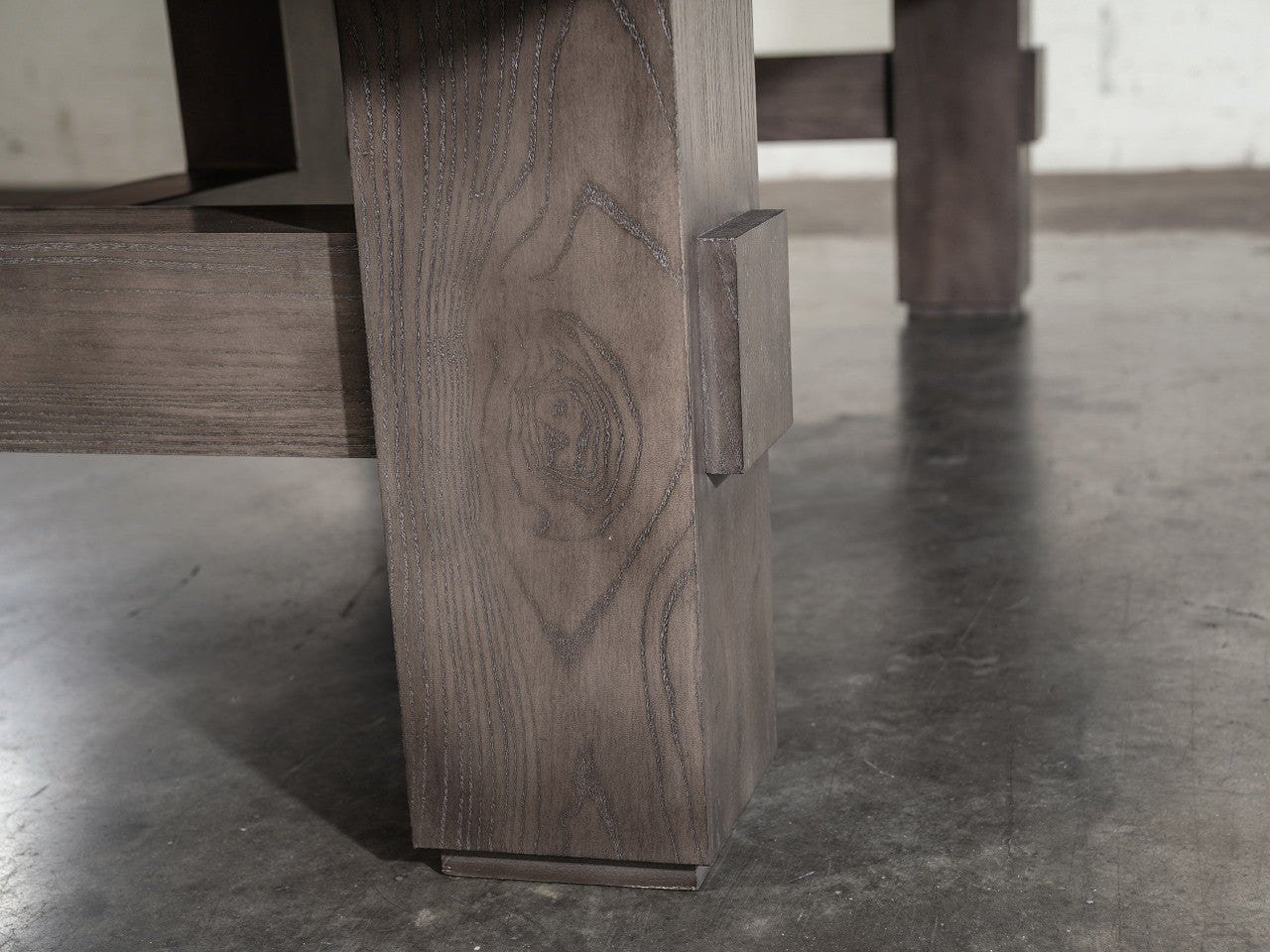 Close-up of Nixon Kemp 8' Slate Pool Table leg in Grayson Grey by Nixon Billiards, wood grain shown.