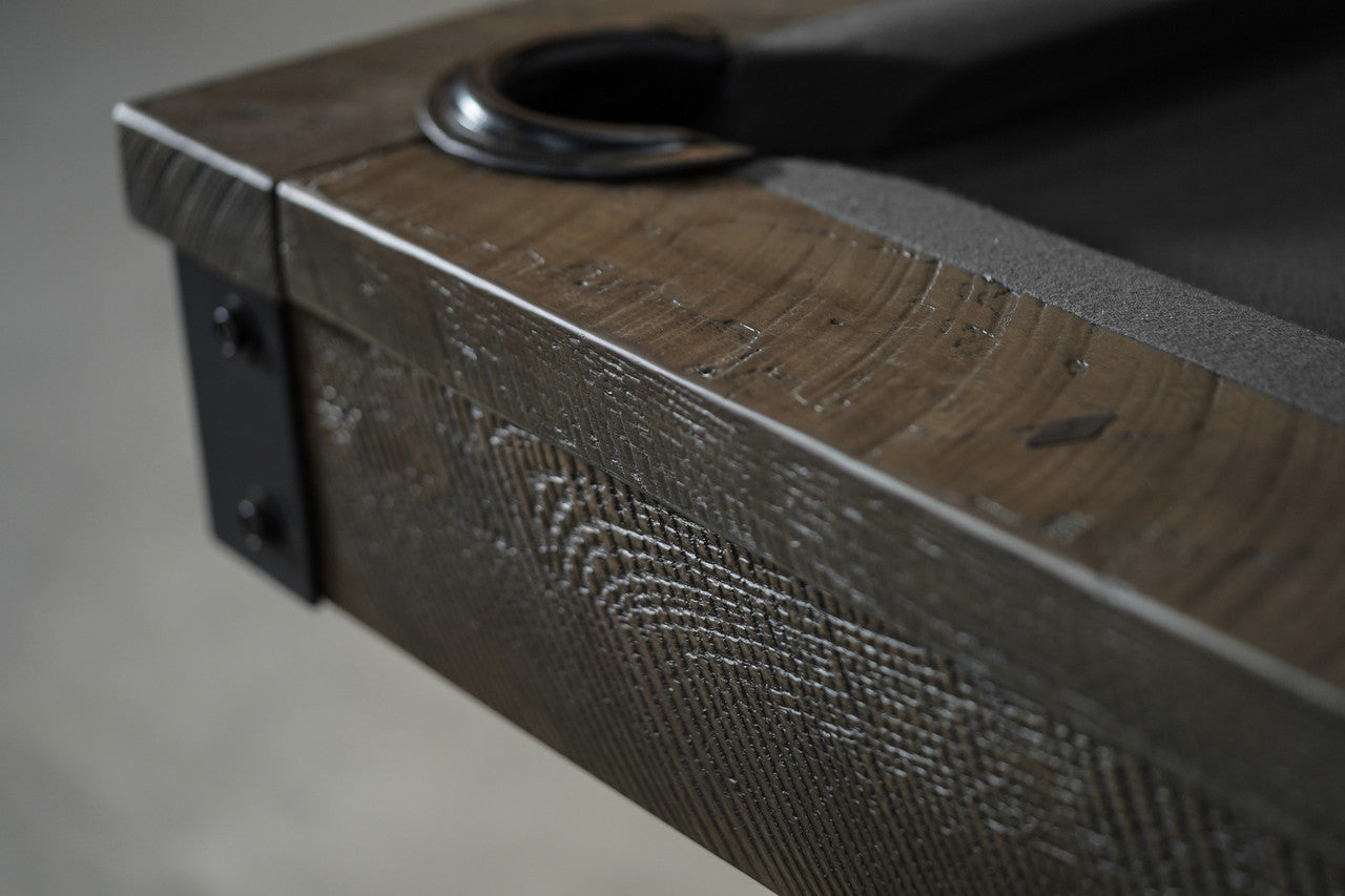 Close-up of Nixon Portland 8' Pool Table by Nixon Billiards in Barnwood finish with metal bracket.