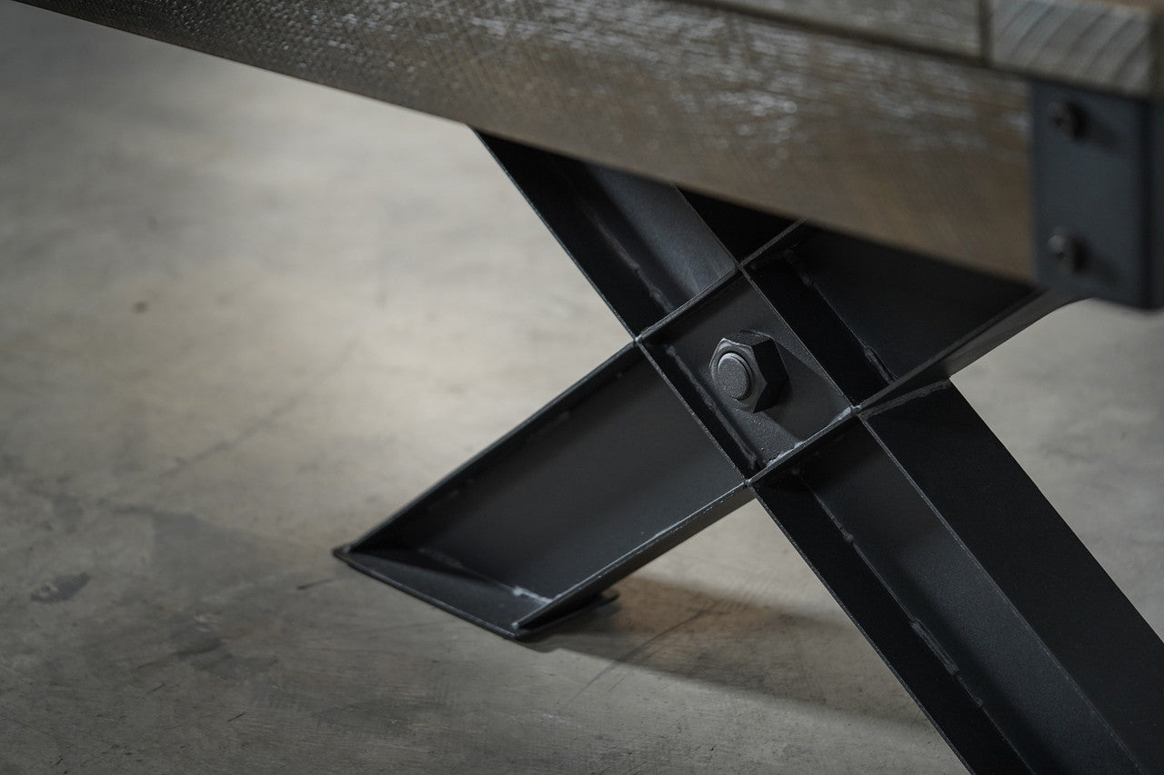 Close-up of a black X-leg from the Nixon Portland 8' Barnwood Pool Table by Nixon Billiards.