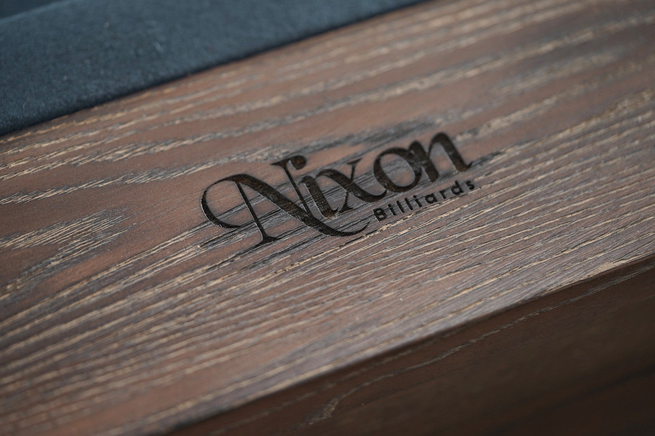 Nixon Billiards logo engraved on Hunter 7' Slate Pool Table in Brushed Walnut finish.