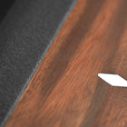 Close-up of Nixon KAI 7' Slate Pool Table in Walnut by Nixon Billiards, white diamond inlay.