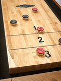 Brunswick Billiards Parsons 12' Shuffleboard Table with black and red pucks on zones 1–3.