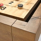 Close-up of the Brunswick Billiards Parsons 12' Shuffleboard Table with pucks and numbered sections.