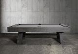 Nixon Georgia 7' Slate Pool Table in Grayson Grey by Nixon Billiards sits in a concrete room.