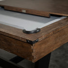 Close-up of a Nixon Hunter 7' Slate Pool Table in Brushed Walnut with dining top partially open.
