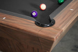 Corner of Nixon KAI 8' Slate Pool Table by Nixon Billiards, with three balls near the pocket.