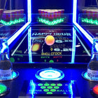 Valley Jet-Pong game by Valley with neon lights, two Corona bottles, and plastic cups behind.