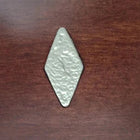 A silver rhombus rests on an American Heritage Billiards Abbey 8' Slate Pool Table in espresso.