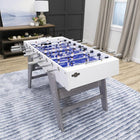 American Legend Manhattan Foosball Table with blue field on striped rug in a modern living room.
