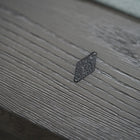 Close-up of a diamond detail on the Nixon Georgia 7' Slate Pool Table in Grayson Grey by Nixon Billiards.