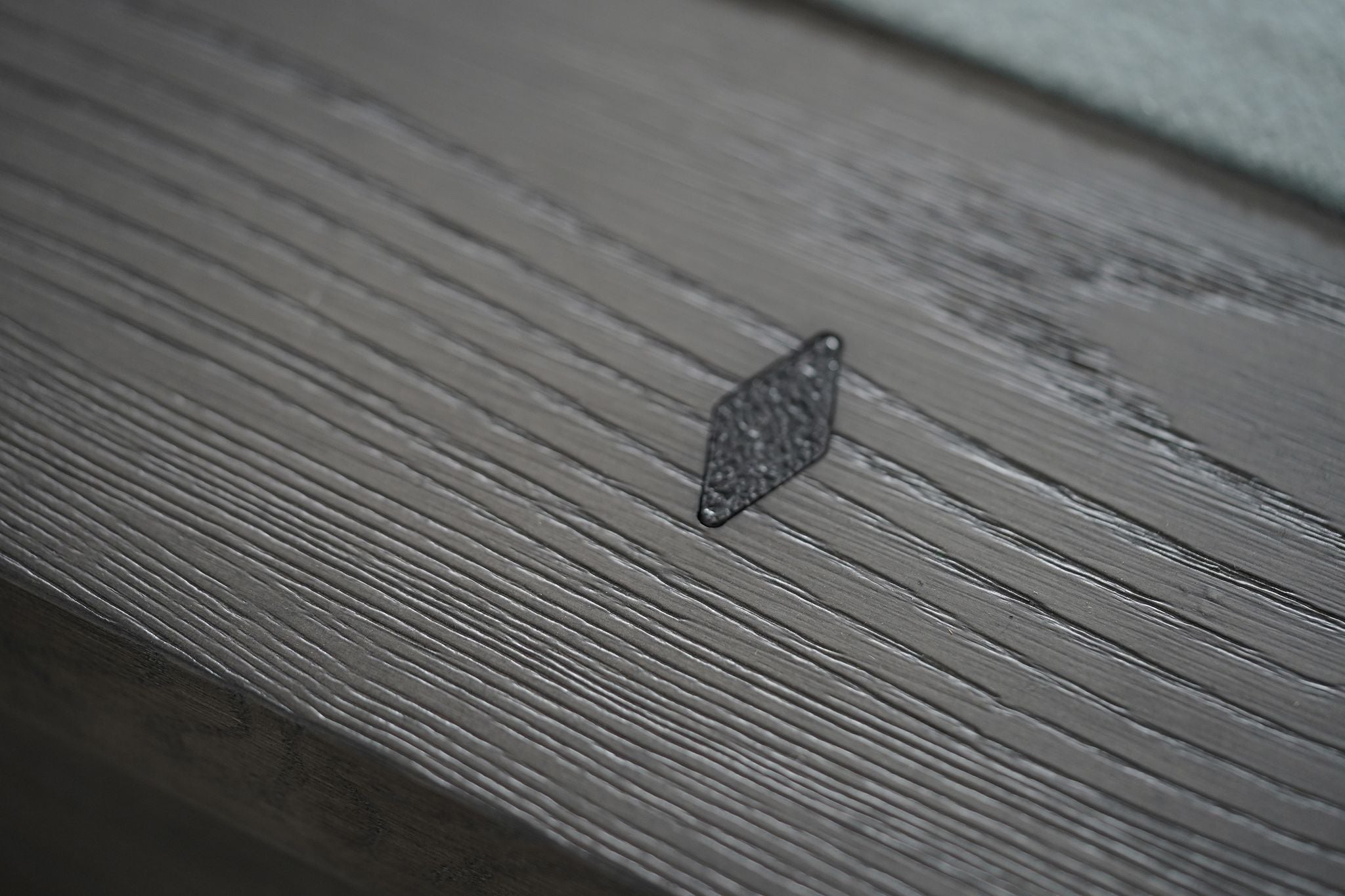 Close-up of Nixon Billiards Georgia 8' Pool Table's rustic Grayson Grey surface with central diamond.