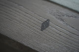 Close-up of a diamond detail on the Nixon Georgia 7' Slate Pool Table in Grayson Grey by Nixon Billiards.