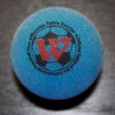 Warrior Set of 4 Pro Game Ball in Blue, featuring red-black Warrior logo, on dark surface.