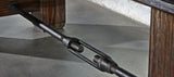 Close-up of a metal turnbuckle on the Brunswick Billiards Canton 14' Shuffleboard Table.