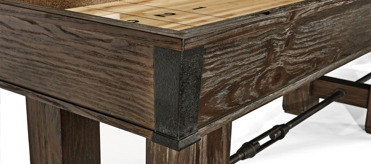 Close-up of Brunswick Billiards Canton 14' Shuffleboard Table in Black Forest with metal accents.