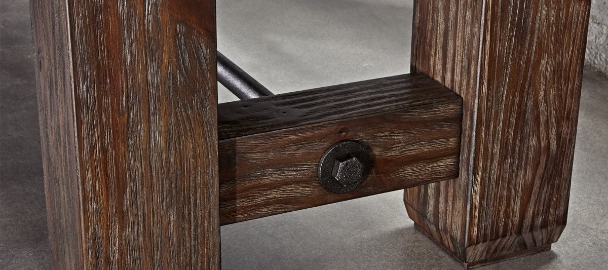 Close-up of Brunswick Billiards Canton 14' Shuffleboard Table legs joined by a dark metal bolt.