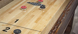 Brunswick Billiards Canton 14' Shuffleboard Table in Black Forest with red and black pucks.