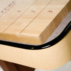 Close-up of the Venture Classic 14' Shuffleboard Table with numbered zones and a sleek black trim.