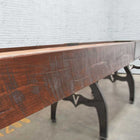 Venture Williamsburg 12' Shuffleboard Table with metal legs in a white brick industrial room.