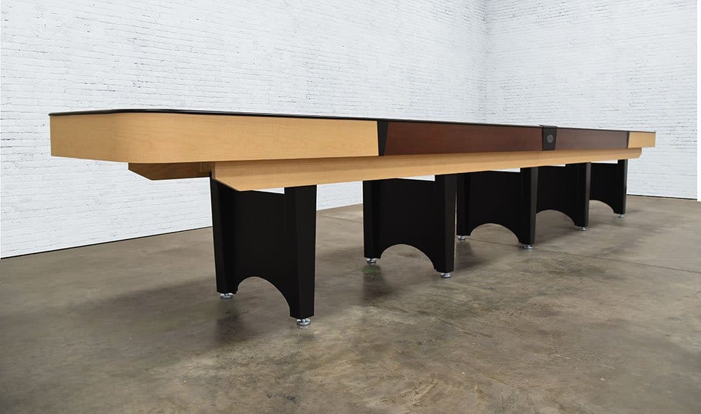 A Venture Classic 14' Shuffleboard Table with black legs stands in a white-walled room.