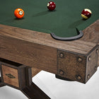 Corner of a Brunswick Billiards Dameron 8' Slate Pool Table in Nutmeg with four balls on felt.