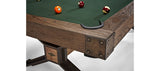 Corner of a Brunswick Billiards Dameron 8' Slate Pool Table in Nutmeg with four balls on felt.
