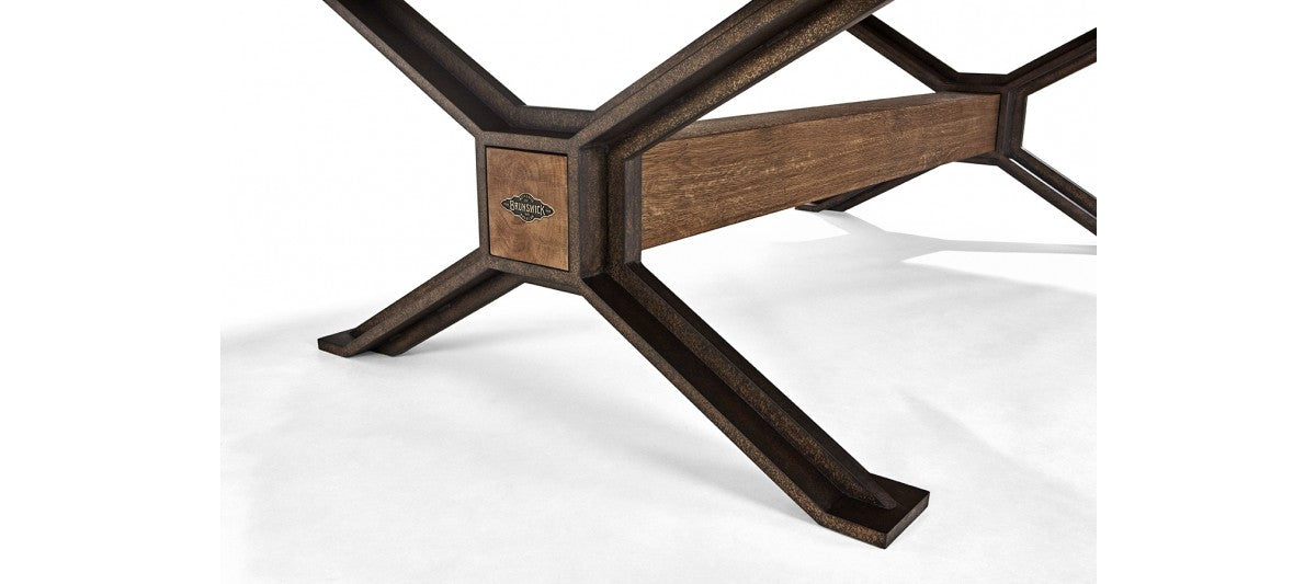 Close-up of Brunswick Billiards Dameron 8' Slate Pool Table in Nutmeg’s cross-shaped base.