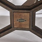 Close-up of Brunswick Billiards Dameron 8' Slate Pool Table in Nutmeg base with logo.