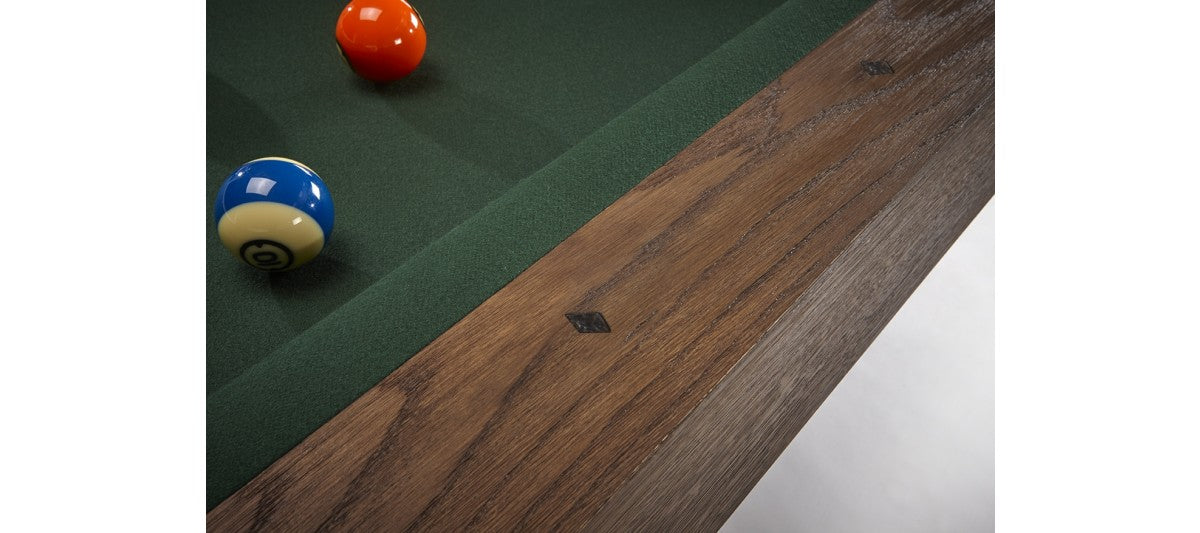 Close-up of a Brunswick Billiards Dameron 8' Slate Pool Table in Nutmeg with pool balls.