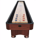 Playcraft Woodbridge 14' Shuffleboard Table in Cherry with red and blue pucks on scoring zones.