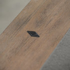 A small black diamond on the Nixon Georgia 7' Slate Pool Table in Weathered Natural finish.