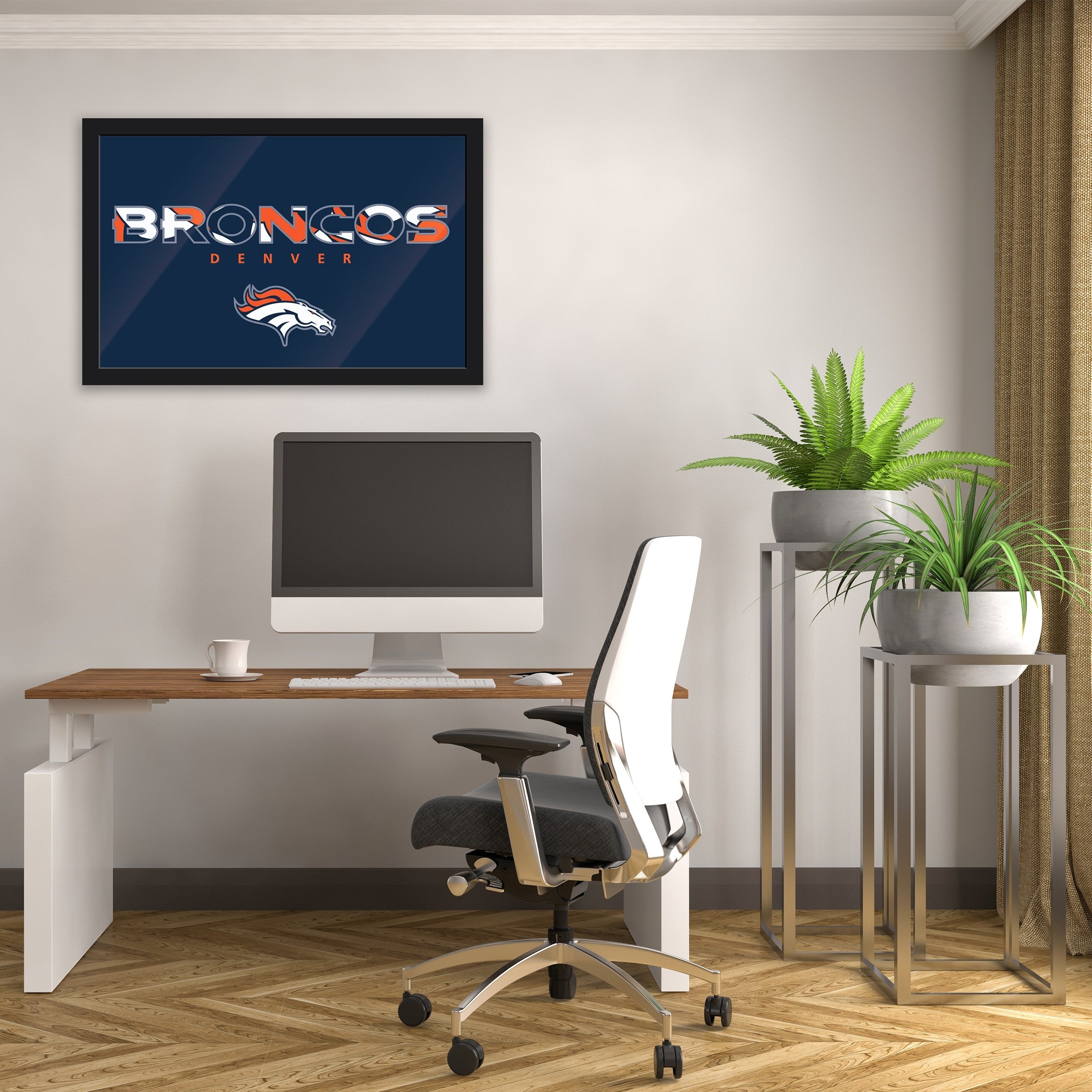 Minimalist home office with computer desk, plants, and Acme Imperial Broncos framed wall art.