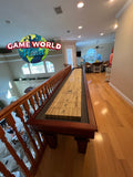 Playcraft St. Lawrence 16' Pro-Style Shuffleboard Table in Chestnut enhances any hallway setting.