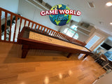 A Playcraft St. Lawrence 16' Shuffleboard Table in Chestnut with a Game World Planet logo above.