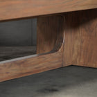 Close-up of Nixon KAI 8' Slate Pool Table legs in walnut by Nixon Billiards on concrete floor.