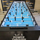 Warrior 8 Players Foosball Table with split bearing, in front of a Warrior backdrop.