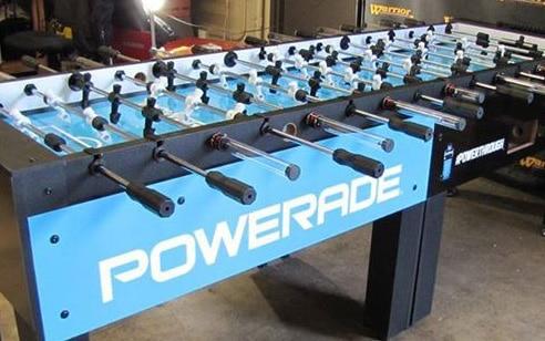 Warrior 8 Players Foosball Table with split bearing in a garage setting.
