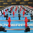 Close-up of Warrior 8 Players Foosball Table with split bearing and Warrior branding on surface.
