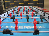 Close-up of Warrior 8 Players Foosball Table with split bearing and Warrior branding on surface.