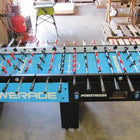 Warrior 8 Players Foosball Table with split bearing in a warehouse setting.